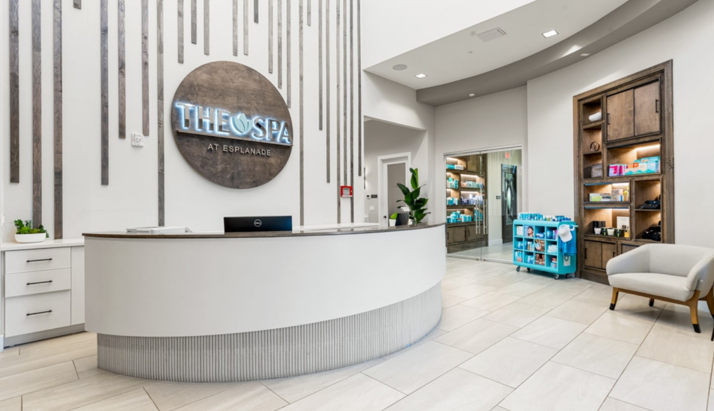 The Spa at Esplanade — its reception desk and illuminated spa sign